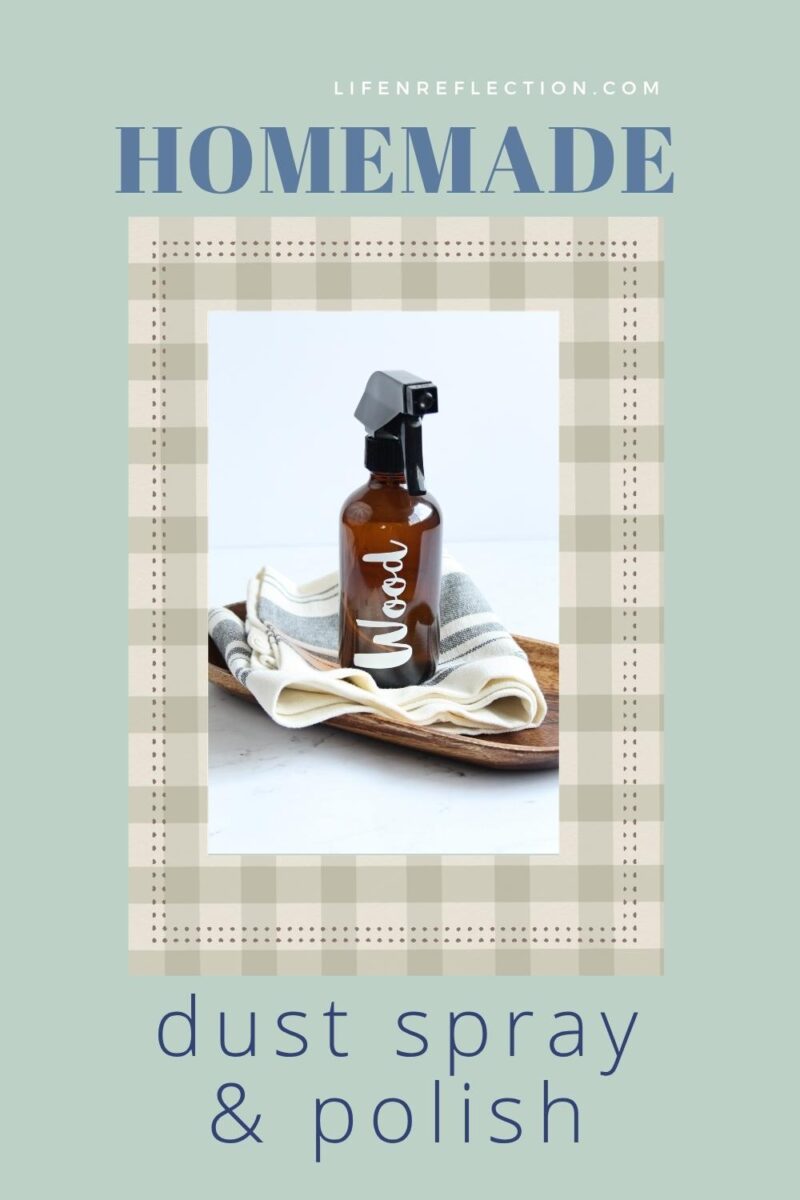 Amber glass spray bottle with a black nozzle, labeled wood on a bright counter with text that reads homemade dust spray and polish