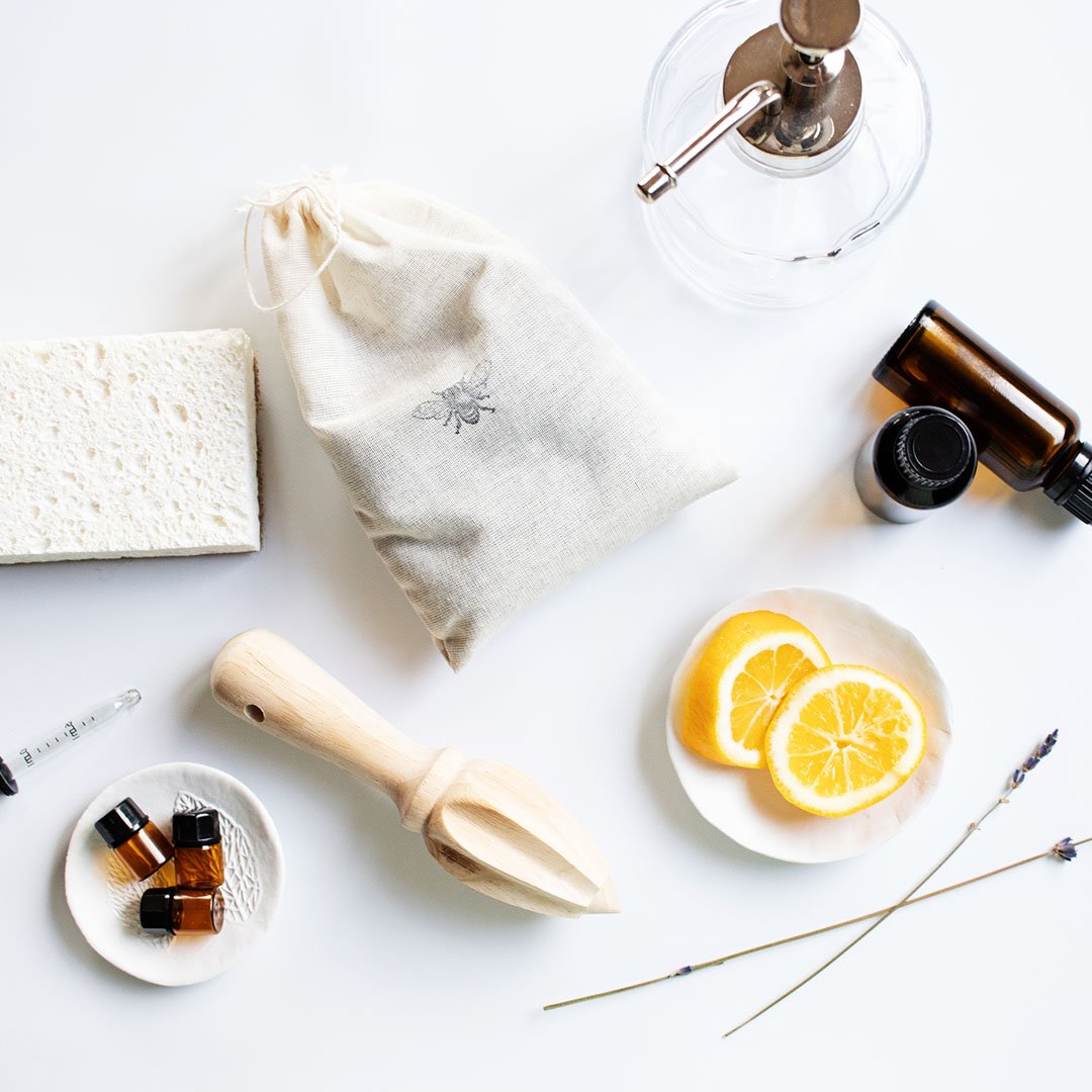 natural cleaning tools on a white countertop