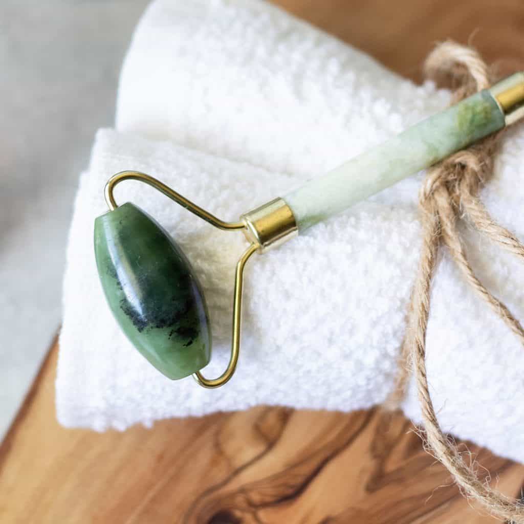 How to reduce the appearance of fine lines and wrinkles by tightening pores and stimulating facial muscles with a jade roller.
