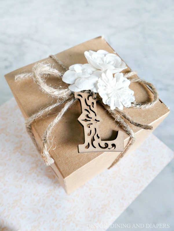 Looking for a soap packaging idea a little more “gift box” like? This beautiful box is personalized with a wooden monogram letter tied with jute on the top for a classy, elegant look.
