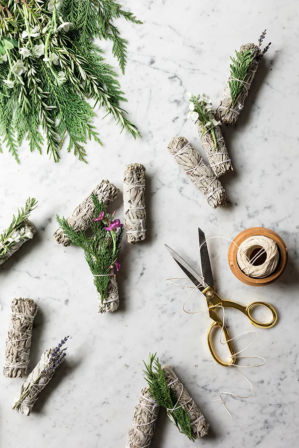 You can make your own DIY sage smudge stick with these instructions using bundles of both dried and fresh herbs and flowers.