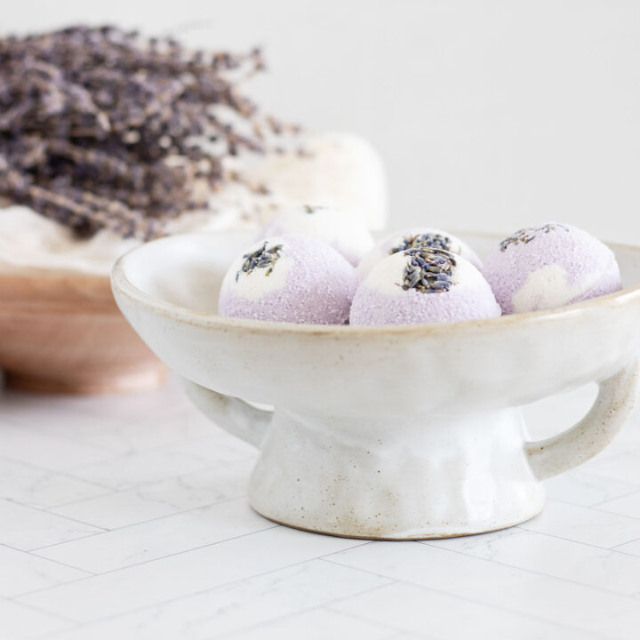 These marbled vanilla swirl lavender bath bombs sprinkled with dried lavender buds and infused with vanilla and lavender essential oil are sweet-smelling and softly romantic.