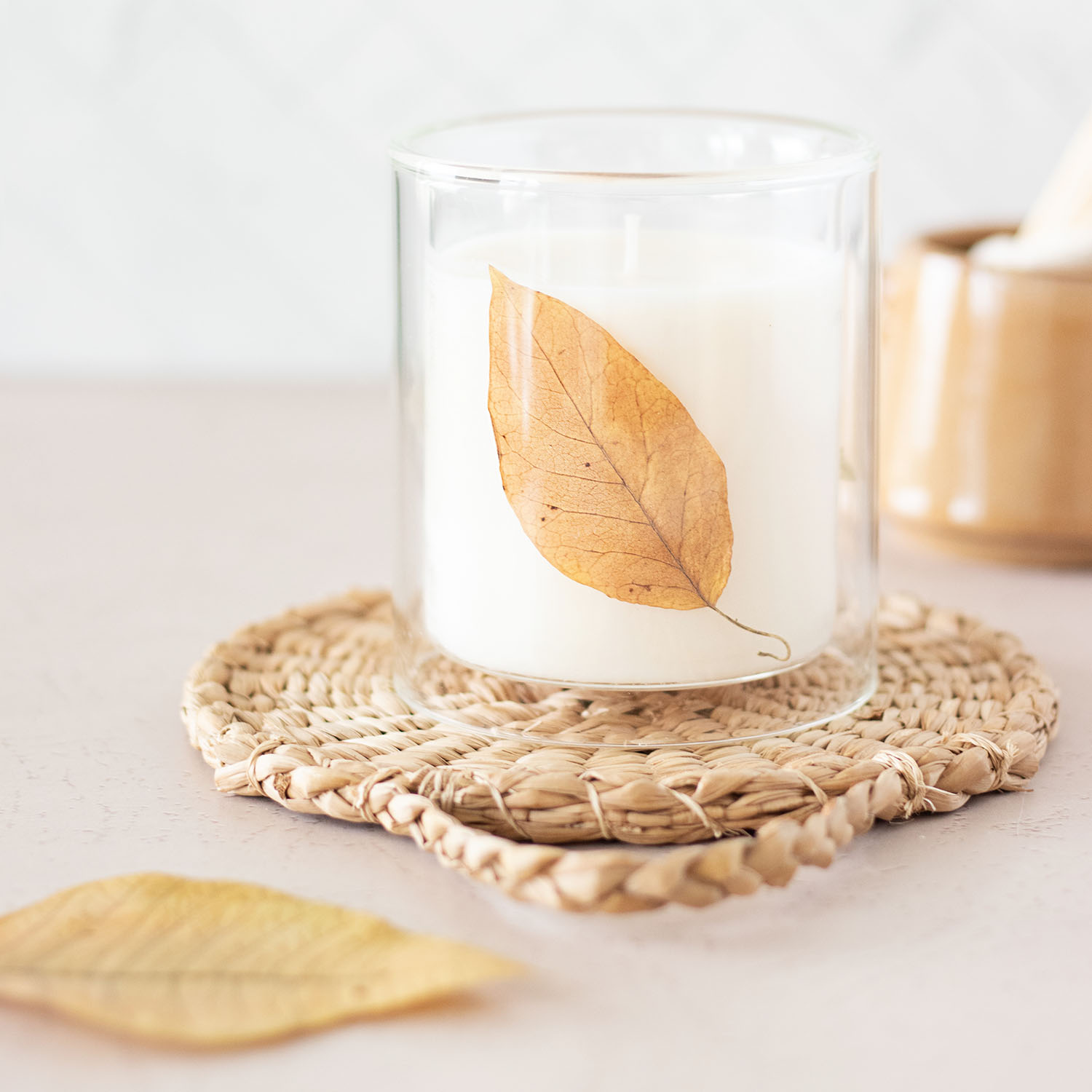 Embrace the season's beauty with this easy-to-make fall leaf candle DIY!
