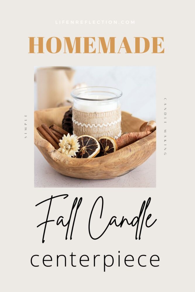 homemade fall candle surrounded by cinnamon sticks, orange slices, and dried flowers