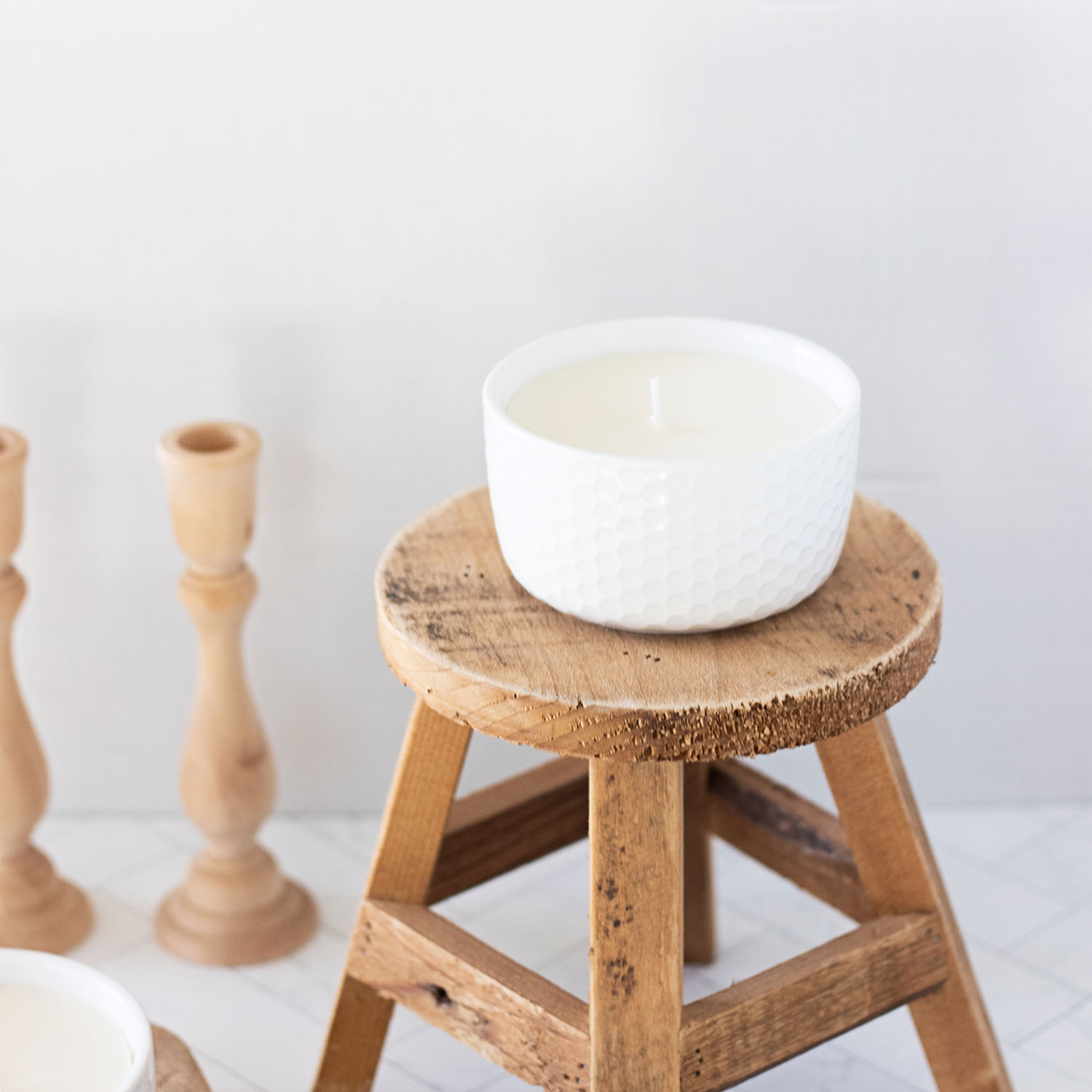 homemade soy wax candle with eco cotton wick on candle stand