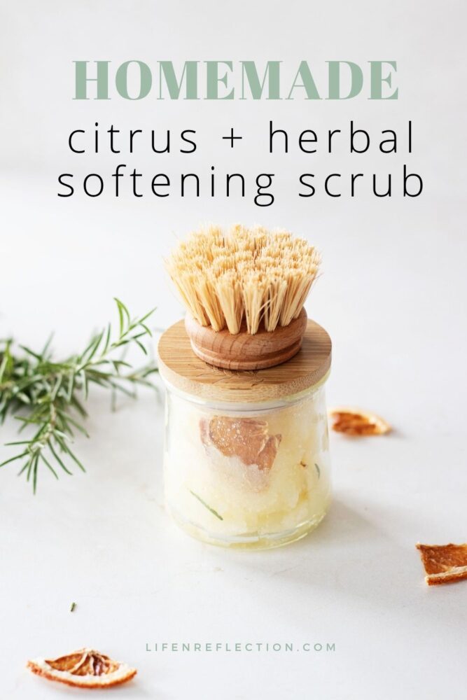 An orange rosemary diy gardeners hand scrub recipe in a glass yogurt jar with a wooden lid