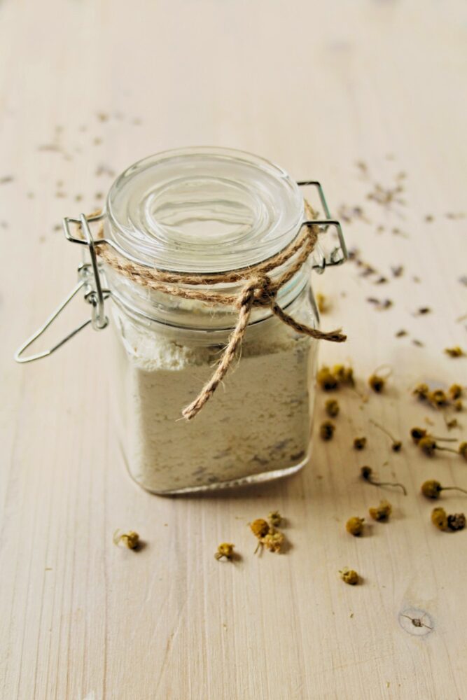 glass jar of an herbal chamomile milk bath