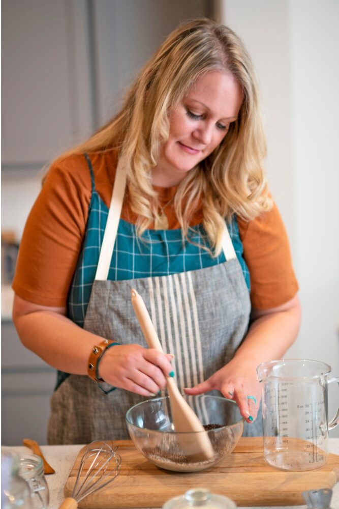 Kristy mixing ingredients in her kitchen during the commerical.